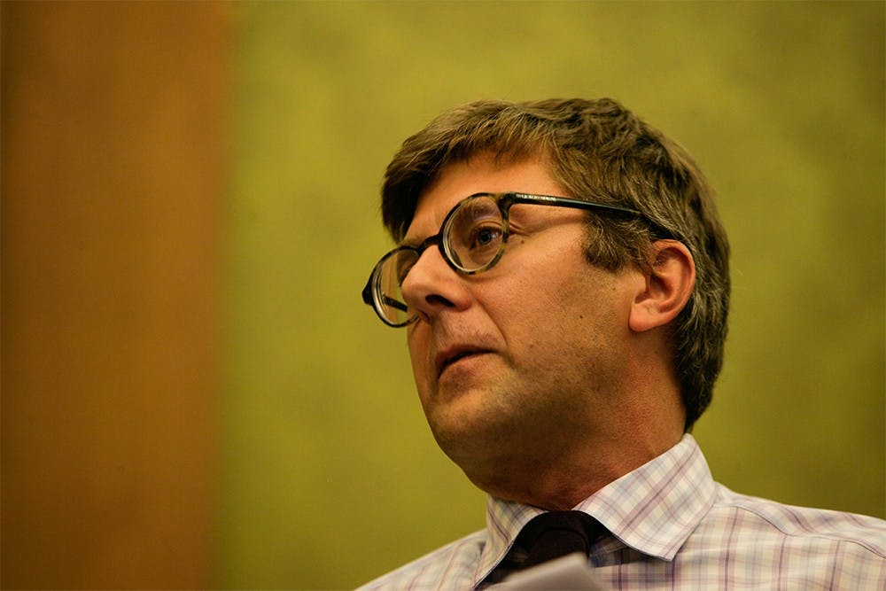 Associate Vice Provost for Research in the Arts and Humanities Edward P. Comentale listens to an audience member asking a question concerning the accessibility of the arts and humanities to students at IU's campus. The meeting took place Tuesday afternoon at the Lilly Library.