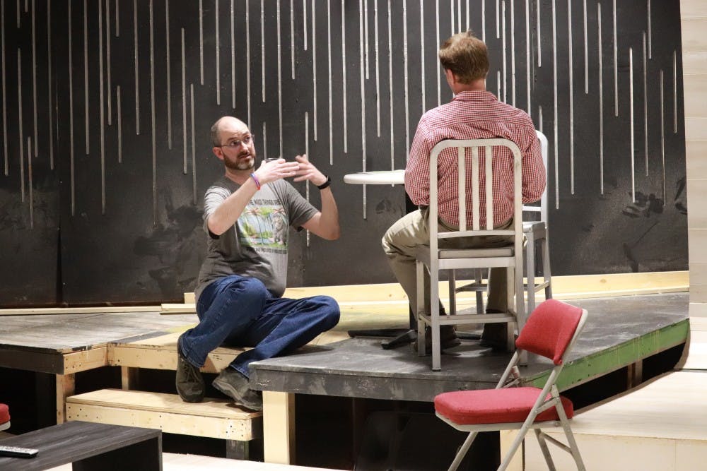 <p>Actors Paul Daily and Patrick Wiegand rehearse in Bloomington Playwrights Project for the play, “Apropos of Nothing.” The play is about a man in love with his best friend’s wife.</p>