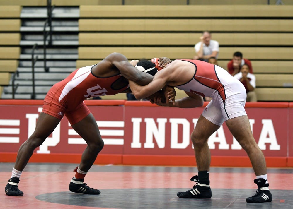 Redshirt freshman Austin Holmes and redshirt freshman Davey Tunon wrestle in the 149 lb weight class in the Cream and Crimson dual on Oct. 26 at the University Gym. IU named Mike Dixon associate head coach on Tuesday.