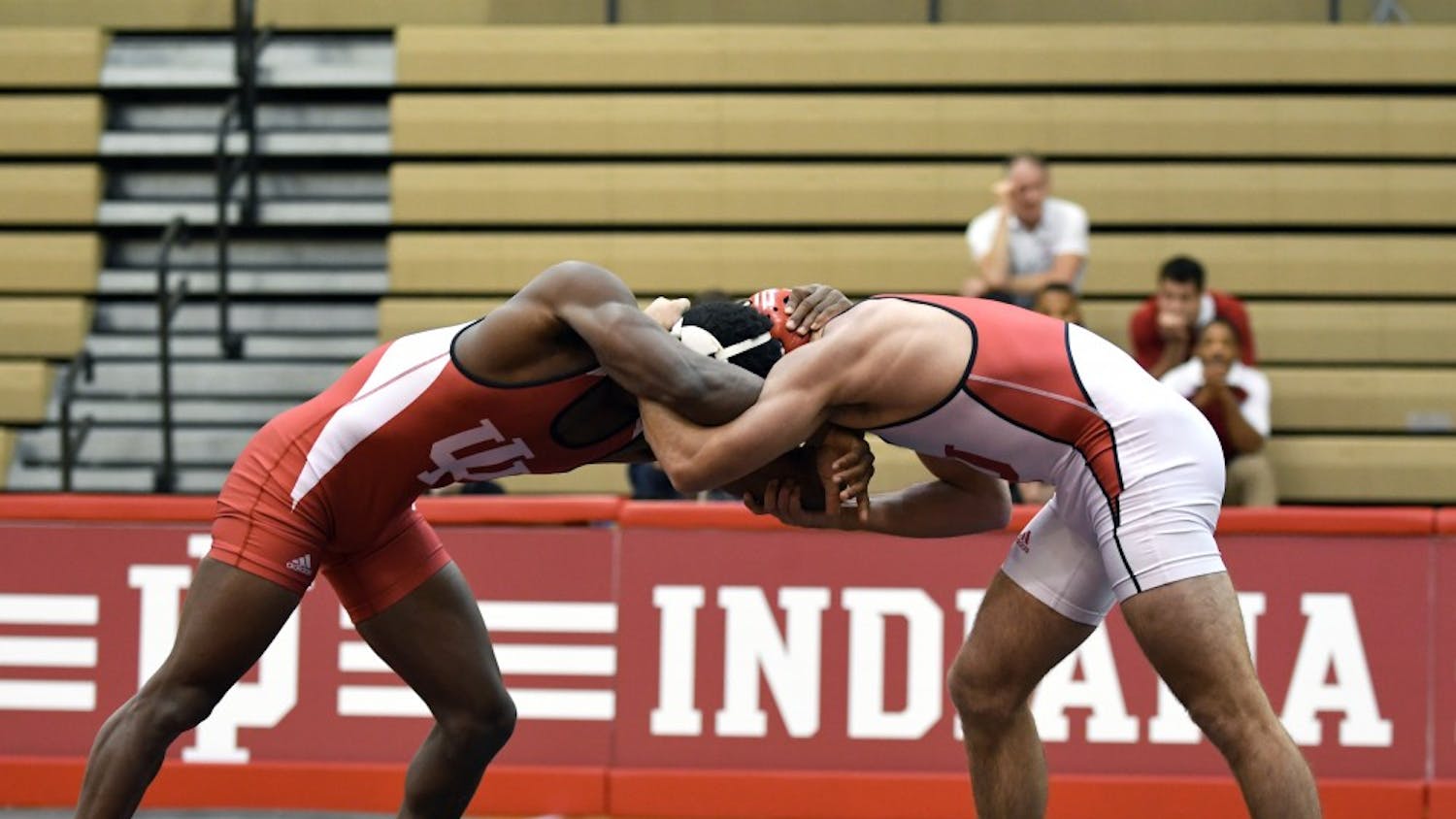 Redshirt freshman Austin Holmes and redshirt freshman Davey Tunon wrestle in the 149 lb weight class in the Cream and Crimson dual on Oct. 26 at the University Gym. IU named Mike Dixon associate head coach on Tuesday.