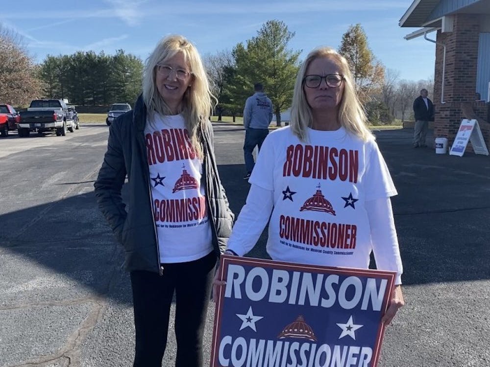 Lisa Hanner-Robinson, left, and Tracy Miracle show their support for county commissioner candidate Perry Robinson at 10:45 a.m. Nov. 8, 2022, outside Southside Christian Church. Hanner-Robinson and Miracle are Perry Robinson&#x27;s wife and sister, respectively.