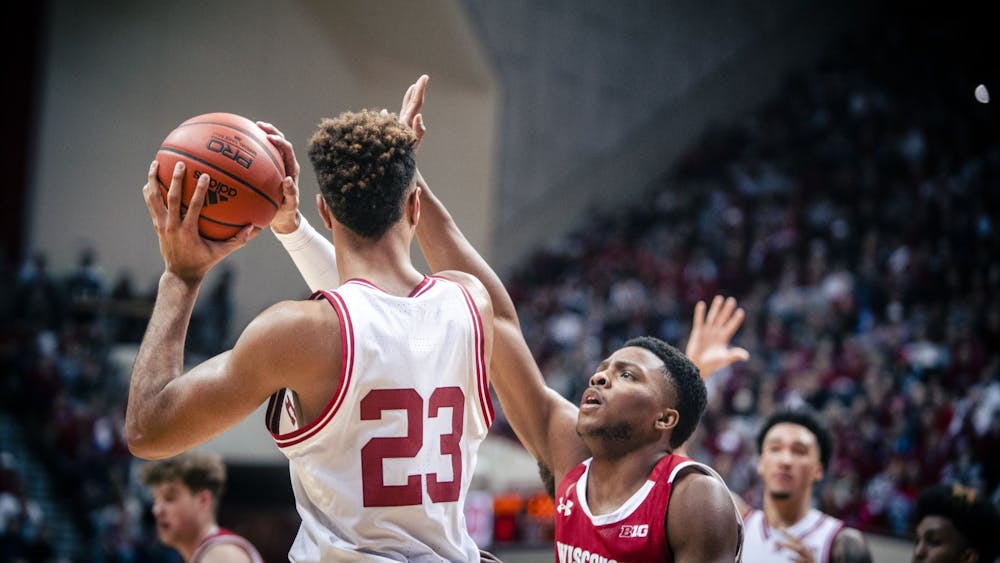 Senior forward Trayce Jackson-Davis looks to pass the ball Jan. 14, 2023 at Simon Skjodt Assembly Hall in Bloomington, Indiana. Jackson-Davis and freshman guard Jalen Hood-Schifino earned All-Conference honors on Tuesday.
