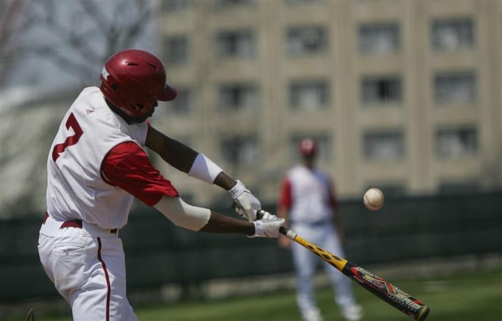 Junior center fielder Evan Crawford swings at the ball Saturday afternoon at Sembower Field. The Hoosiers won 15-1 and 3-2 in a doubleheader against Penn State.