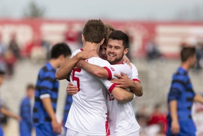 Senior defender Timmy Mehl, sophomore midfielder Justin Rennicks and senior midfielder Austin Panchot celebrate after Mehl scored a second goal against the Air Force on Nov. 25 at Bill Armstrong Stadium during the third round of the NCAA Tournament.