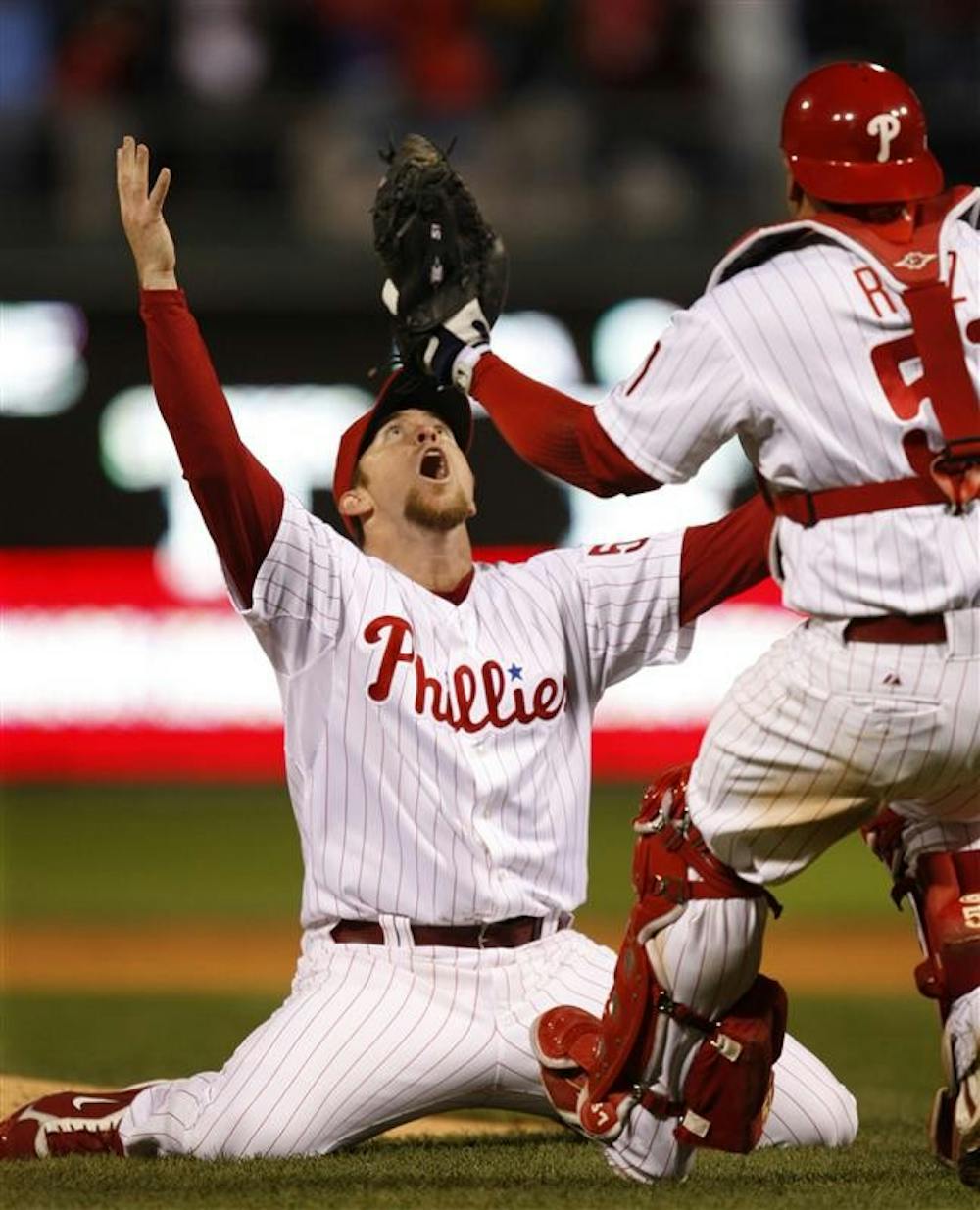 Philadelphia Phillies' Brad Lidge reacts as Carlos Ruiz runs over to hug him after Game 5 of the World Series on Wednesday in Philadelphia. The Phillies defeated the Tampa Bay Rays 4-3 to win the series.