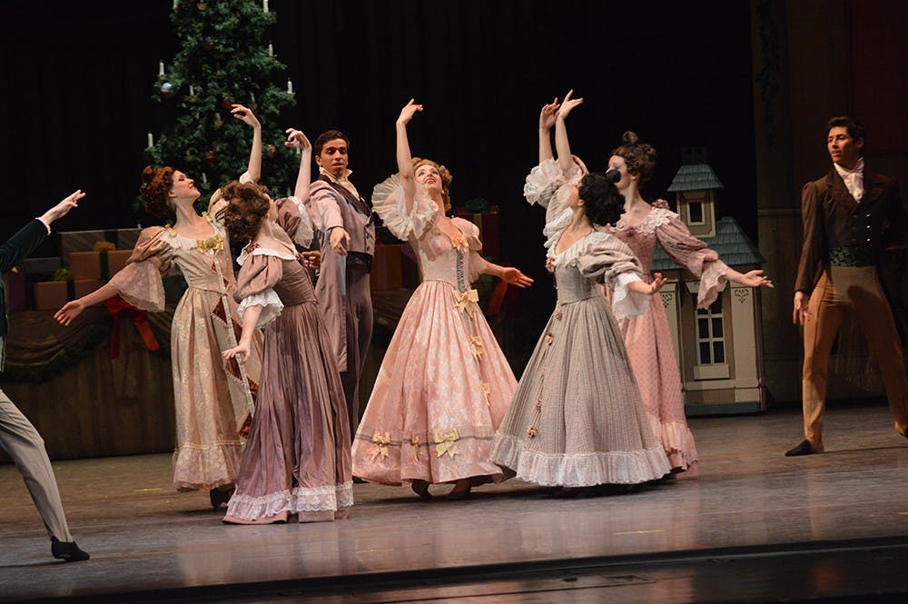 Women from the cast of "The Nutcracker" dance in a circle during a dress rehearsal on Monday night in the Musical Arts Center. The show opens on Dec. 3 and has shows through Dec. 6.