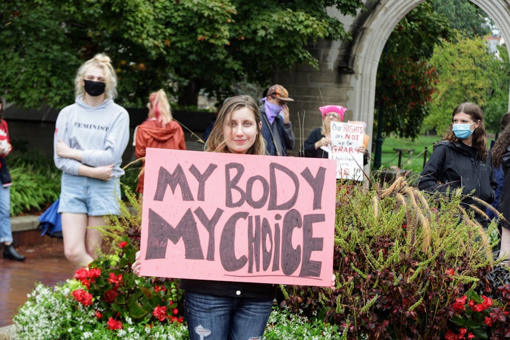 <p>Then-IU doctoral student Kirsten Greer holds a &quot;My Body, My Choice&quot; sign Oct. 2, 2021, at the Sample Gates. Senator Shelli Yoder, D-Bloomington, and Representative Matt Pierce, D-Bloomington, spoke out against the decision to overturn Roe v. Wade.</p><p></p>