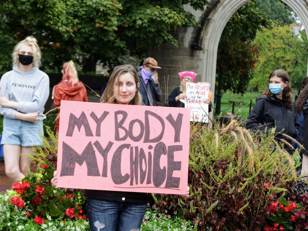Then-IU doctoral student Kirsten Greer holds a &quot;My Body, My Choice&quot; sign Oct. 2, 2021, at the Sample Gates. Senator Shelli Yoder, D-Bloomington, and Representative Matt Pierce, D-Bloomington, spoke out against the decision to overturn Roe v. Wade.