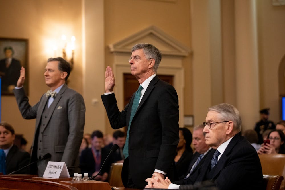 Deputy Assistant Secretary for European and Eurasian Affairs George Kent, left, and William B. Taylor, right, swear in to the House Intelligence Committee&#x27;s first public inquiry into the interaction between President Donald Trump and the government of Ukraine on Nov. 13 at the U.S. Capitol in Washington, D.C. 