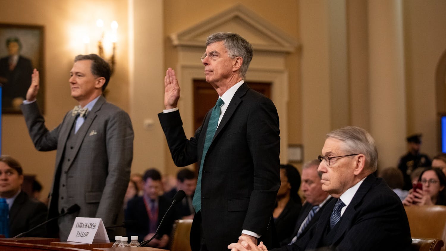 Deputy Assistant Secretary for European and Eurasian Affairs George Kent, left, and William B. Taylor, right, swear in to the House Intelligence Committee&#x27;s first public inquiry into the interaction between President Donald Trump and the government of Ukraine on Nov. 13 at the U.S. Capitol in Washington, D.C. 