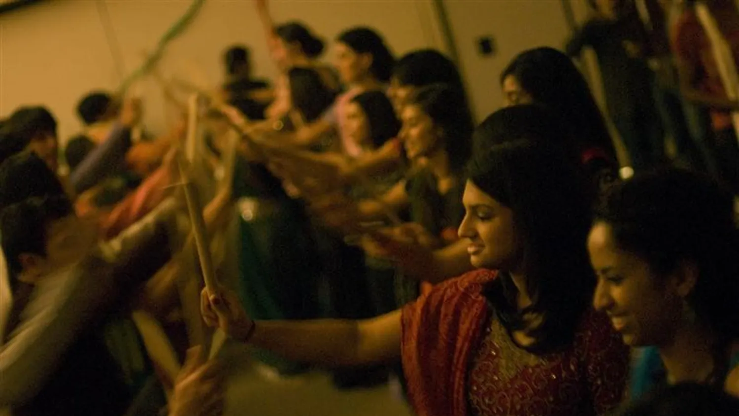 Members of the Indian Student Association dance Raas on Saturday night at the Bloomington Convention Center. The dance originates from Punjabi, a the northern region of India. The dance is performed in celebration of Navaratri, a nine-day festival venerating female divinites.