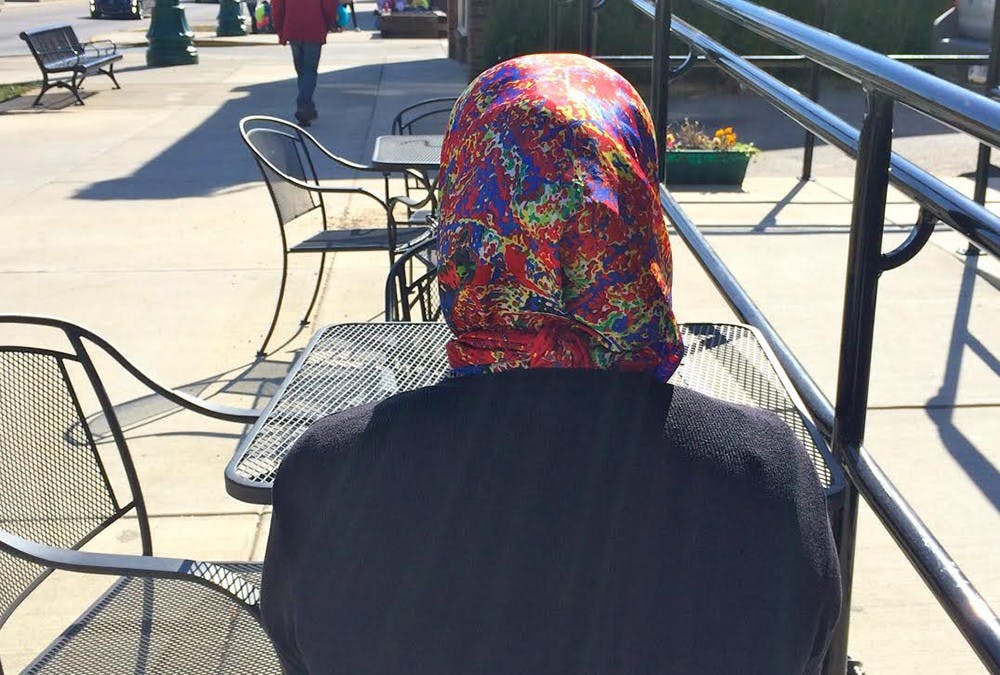 The woman who was attacked by 19-year-old IU student Triceten Bickford sits at the same table outside Sofra Café where she was strangled on Saturday. Bickford faced charges of strangulation, battery, minor possession of and consumption of alcohol, intimidation and public intoxication. Bickford was released from the Monroe County Jail Sunday after paying a total of $705.