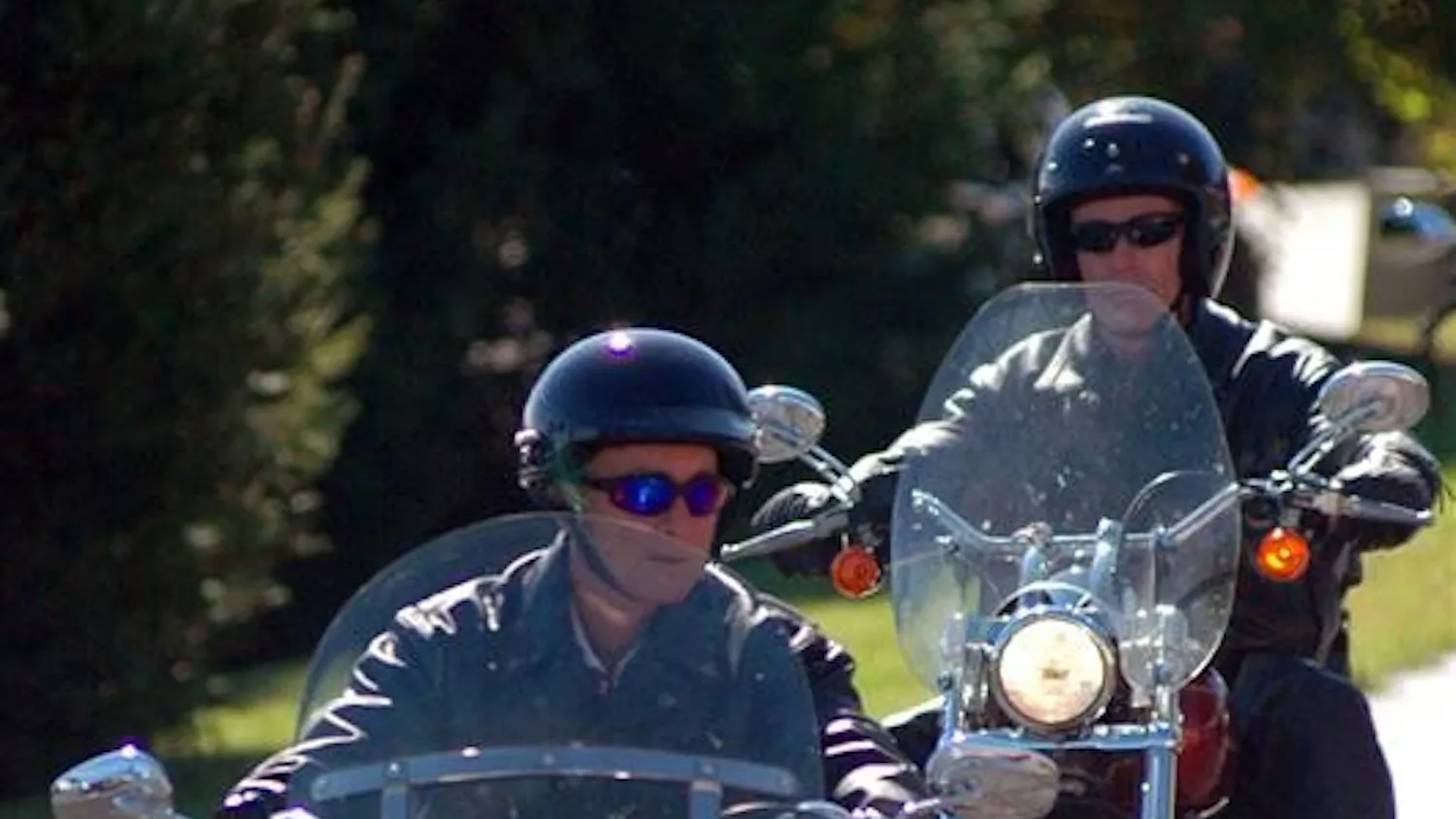 Gov. Mitch Daniels, left, leads a group of about 300 motorcycles into a Harley-Davidson dealership on Friday in Bloomington. Daniels rode with members of the American Bikers Aimed Towards Education on the ride, benefiting the National Guard Relief Fund.