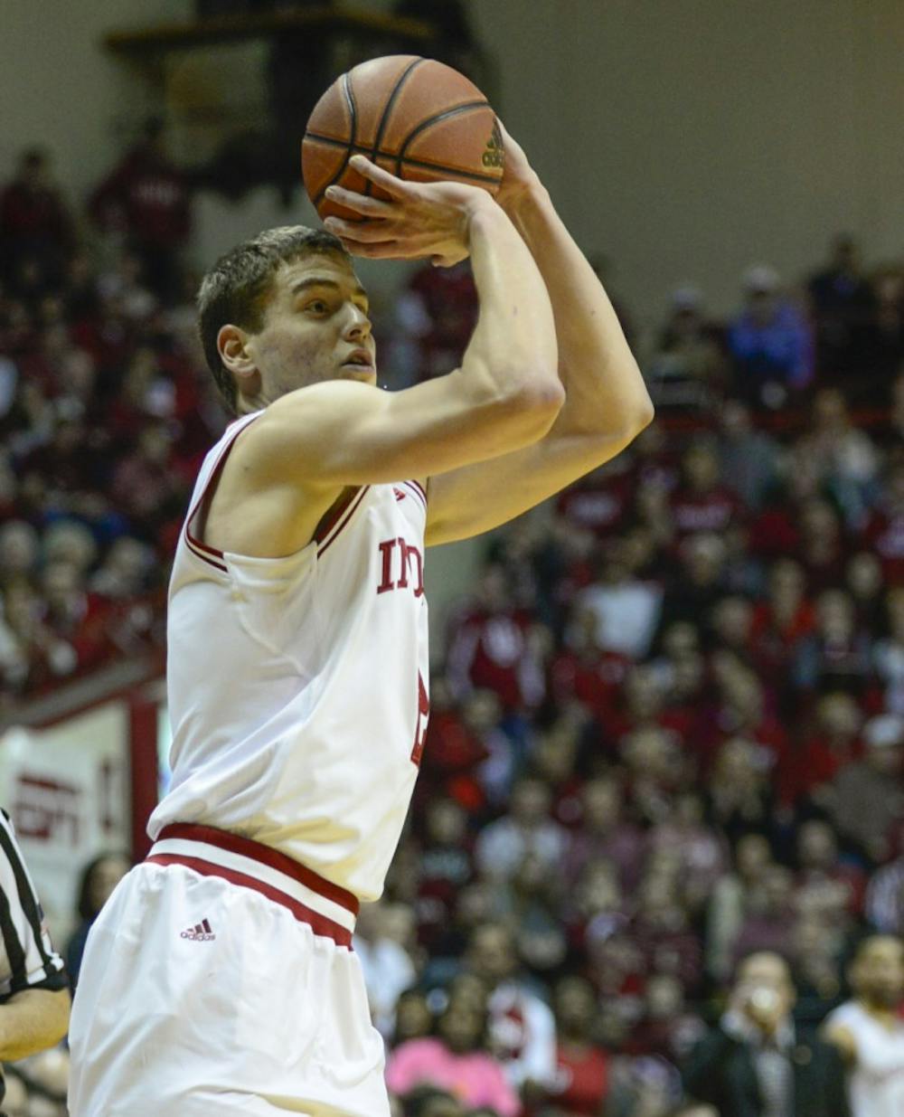 Junior guard Nick Zeisloft shoots a three-point shot during IU's game against Michigan State on Saturday at Assembly Hall.