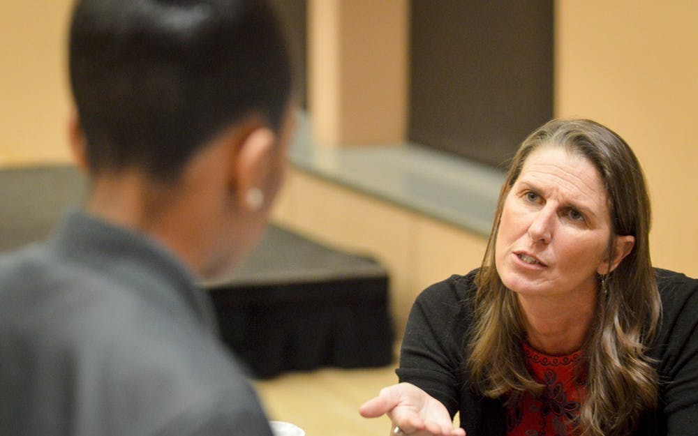 IU Sexual Assault Crisis (SACS) Counselor Ann Skirvin speaks to students about the services they offer in the IU Health Center during the “Black Love, Sex, and Everything Else” event Wednesday evening in the Neal Marshall Black Culture Center. Students enjoyed open dialogue, games of facts and fiction about sex, and discussions on relationship and gender norm stereotypes.