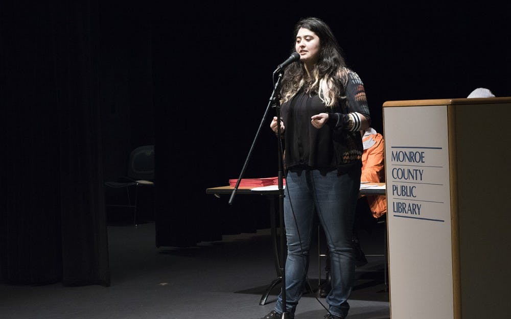 Daniela Gutierrez from the UndocuHoosier Alliance tells participants in El Centro's event Tuesday night that they can get free law advice, mental health counseling and information on their rights. The event at the Monroe County Public Library catered specifically to immigrants and undocumented students in Bloomington.