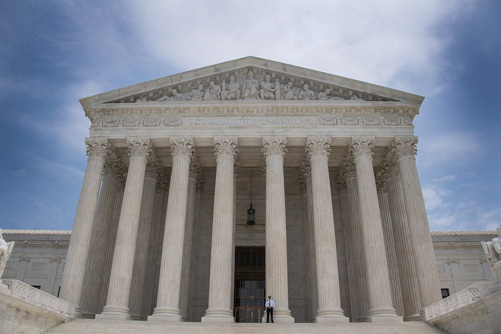 A police officer stands guard June 15, 2017, on the steps of the U.S. Supreme Court in Washington, D.C.