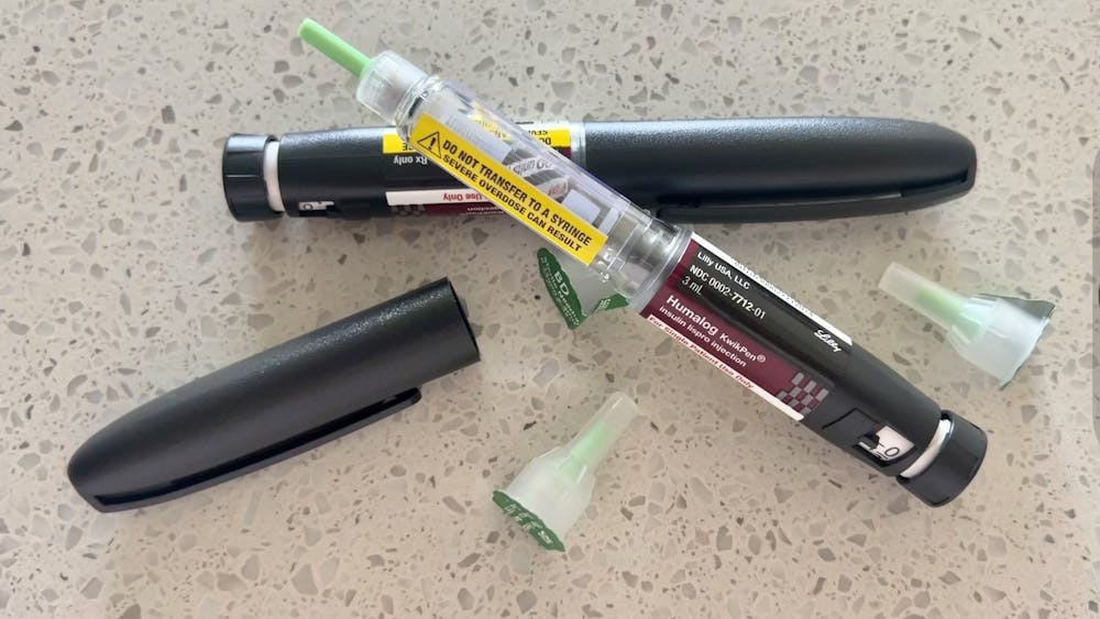 An ﻿Insulin Lispro Injection pen is shown on a table. Eli Lilly announced Wednesday that it will immediately limit the price of insulin to $35 at most retail pharmacies.