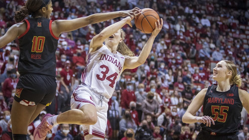 Senior guard Grace Berger gets fouled on a layup Jan. 2, 2022, at Simon Skjodt Assembly Hall. IU lost to Maryland on Feb. 25, 2022, 64-67.