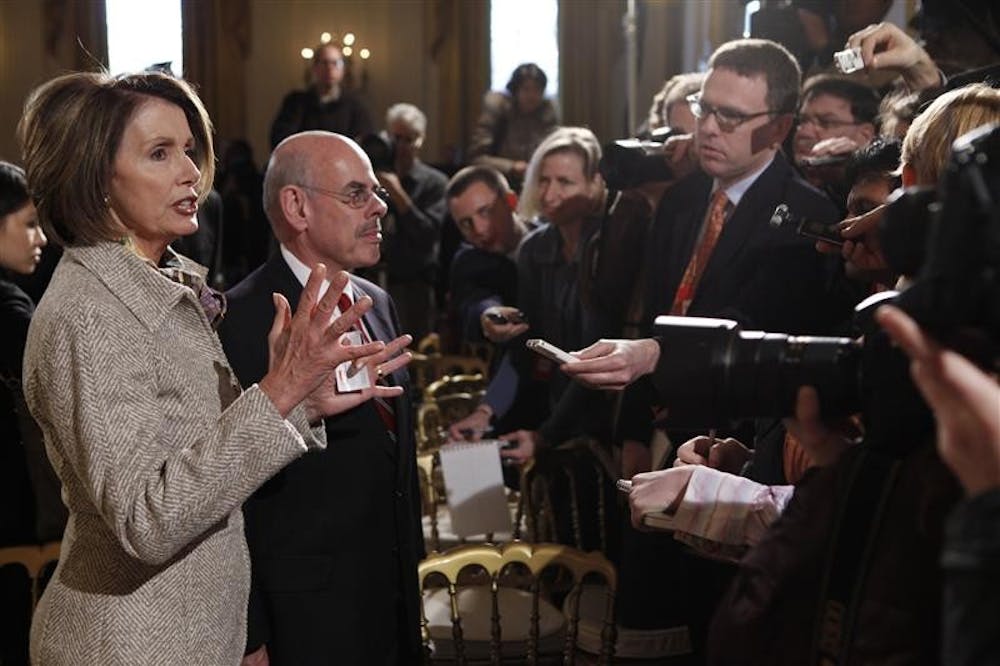 House Speaker Nancy Pelosi, D-Calif., and Rep. Henry Waxman, D-Calif., speak to reporters Monday in the East Room of the White House in Washington after President Barack Obama convened the Fiscal Responsibility Summit.