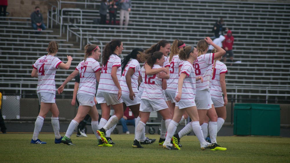 The IU women&#x27;s soccer team huddles together Feb. 28, 2021 at Bill Armstrong Stadium during a game against Iowa. Their next game will be Aug. 25, 2022, against Ball State. 
