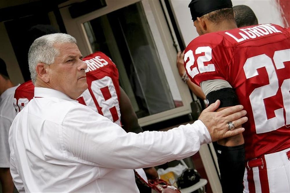 Outgoing Athletics Director Rick Greenspan consoles players as they enter the lockeroom following the Hoosiers' 42-29 loss to Michigan State on Sept. 27 at Memorial Stadium.