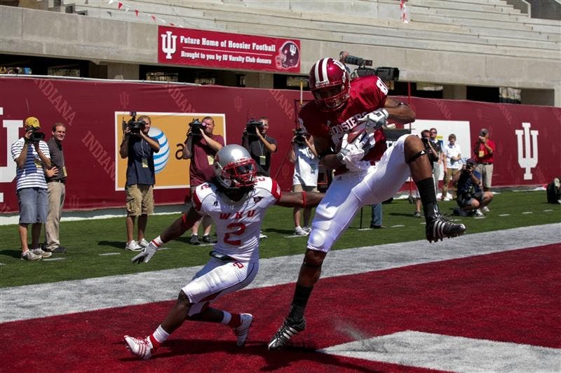 Freshman wide receiver Damario Belcher grabs a touchdown pass in front of a Western Kentucky defender on Saturday at Memorial Stadium.