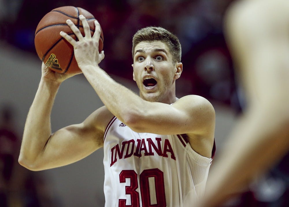 Senior forward Collin Hartman passes the ball against the University of Indianapolis during an exhibition game Nov. 5 at Simon Skjodt Assembly Hall. Hartman and IU defeated Iowa 77-64 Monday night for IU's first Big Ten Conference win.