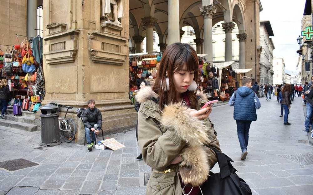 While wandering through Florence, tourists are often caught up in capturing moments rather than experiencing them. 
