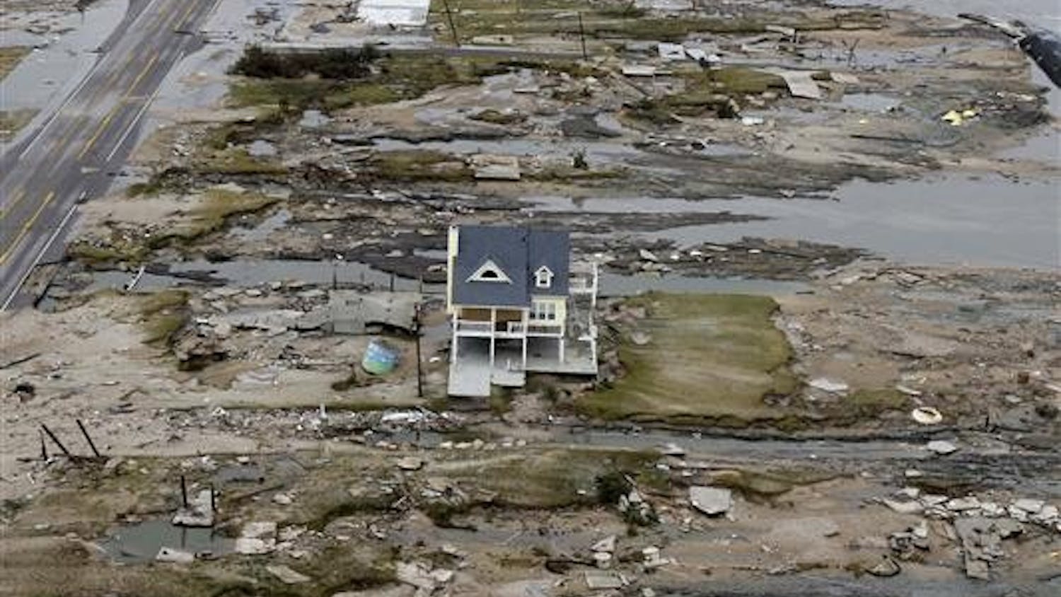 With the Gulf of Mexico seen at right, a beachfront home stands among the debris on Sunday after Hurricane Ike hit the area in Gilchrist, Texas. Ike was the first major storm to directly hit a major U.S. metro area since Hurricane Katrina devastated New Orleans in 2005.