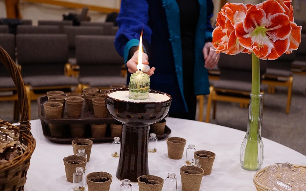 A candle is lit after the spring equinox celebration Monday evening&nbsp;at the Unitarian Universalist Church. Spring equinox is the beginning of the spring season.