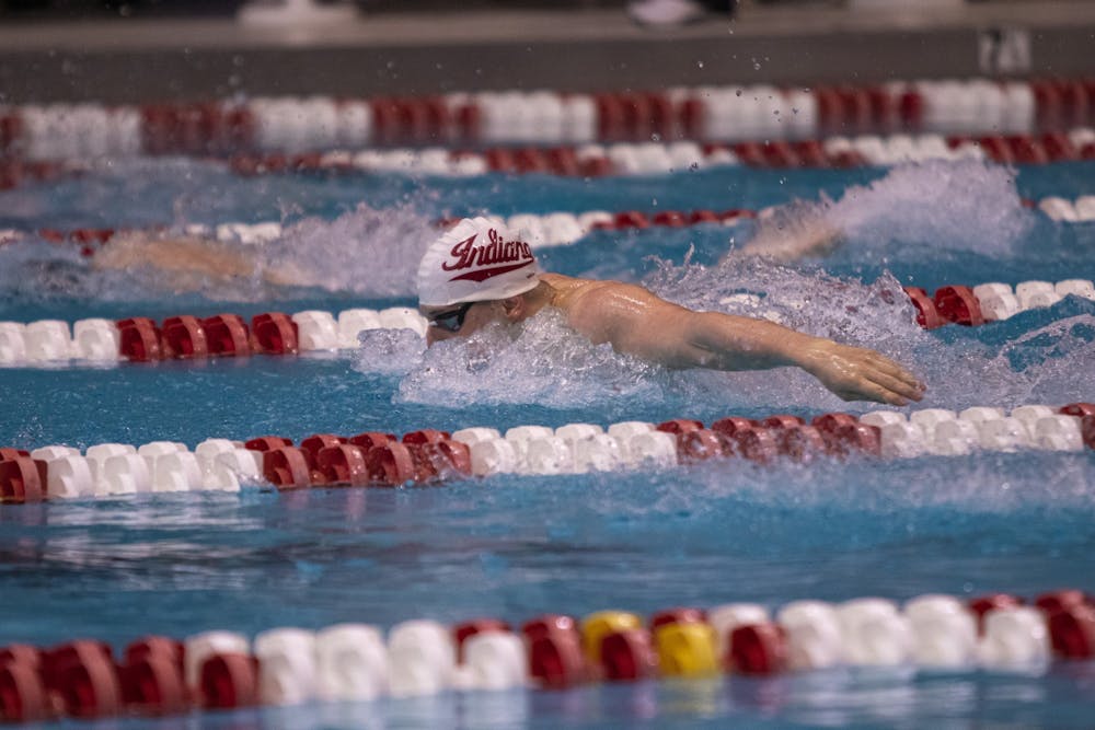 <p>Then-sophomore Jakub Karl competes in a butterfly event Feb. 29, 2020, at Counsilman-Billingsley Aquatics Center. Indiana and Michigan mutually agreed to cancel their swim and dive meet scheduled for Saturday due to COVID-19 concerns.<br/><br/></p>