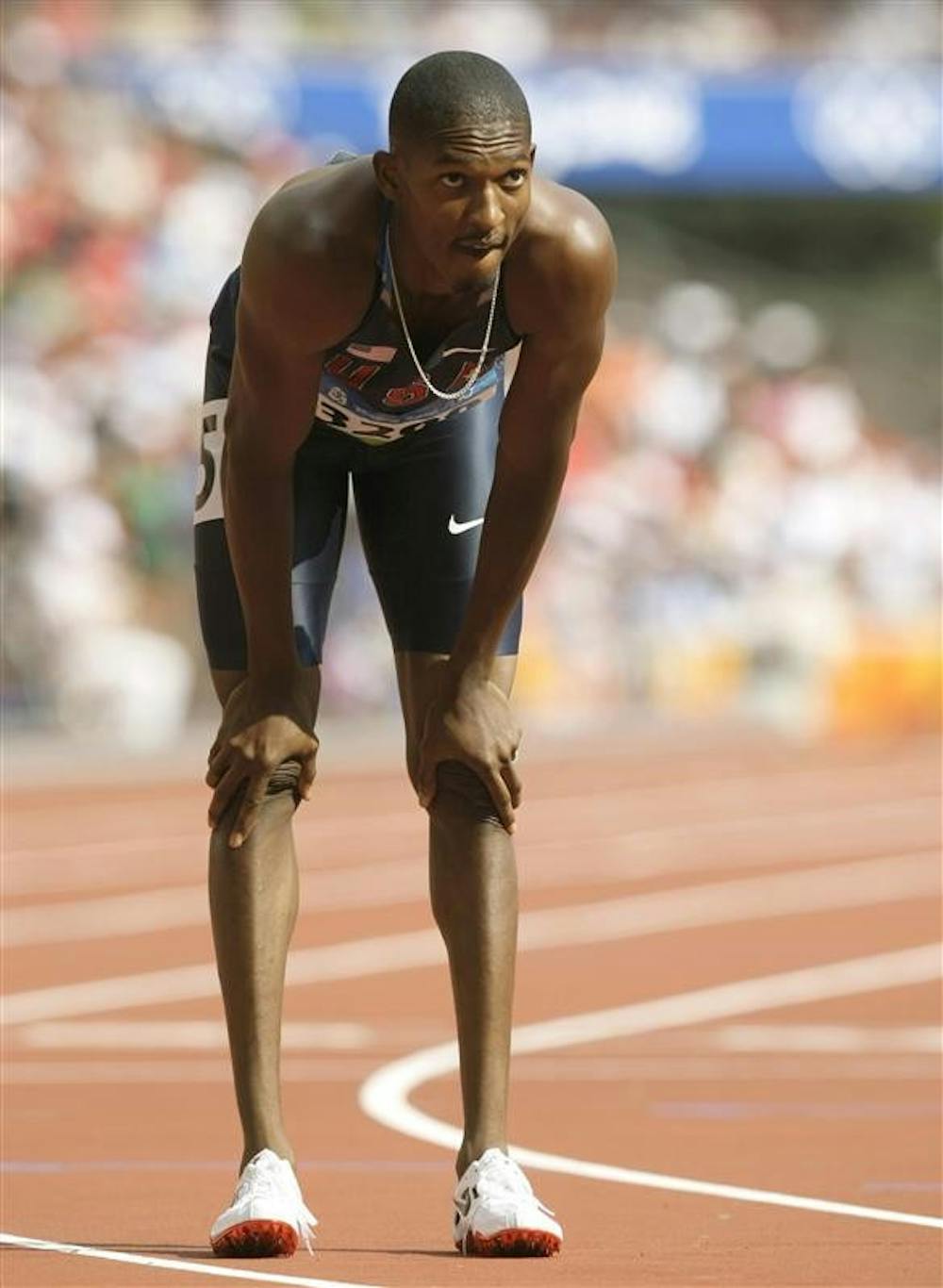 IU alumnus David Neville reacts after the men's 400-meter heat Monday during the athletics competitions in the National Stadium at the Beijing 2008 Olympics in Beijing.