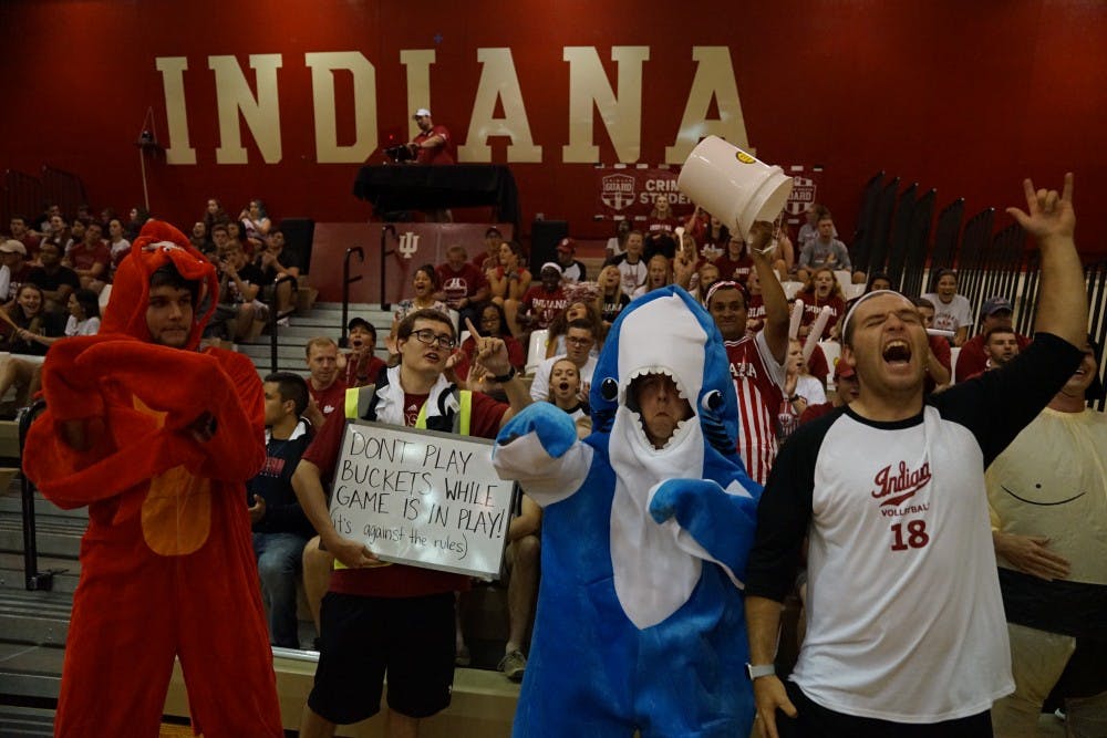 <p>The IU student section cheers after the volleyball team scores a point against Northwestern on Sept. 21 in the University Gym. IU won 3-1 against Northwestern on Friday before losing 3-2 to Illinois on Sunday.</p>