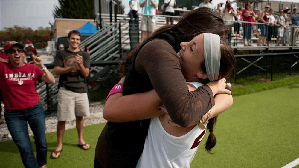 Junior forward Morgan Fleetwood hugs a supporter Sunday at the IU Field Hockey Complex. Fleetwood scored one goal against Michigan State, helping lead the the No. 15 Indiana field hockey team win 4-2 against Michigan State for Senior Day on Sunday. IU rounded out their record at 8-4-0 before taking on Iowa on Oct. 15 at 1 p.m.