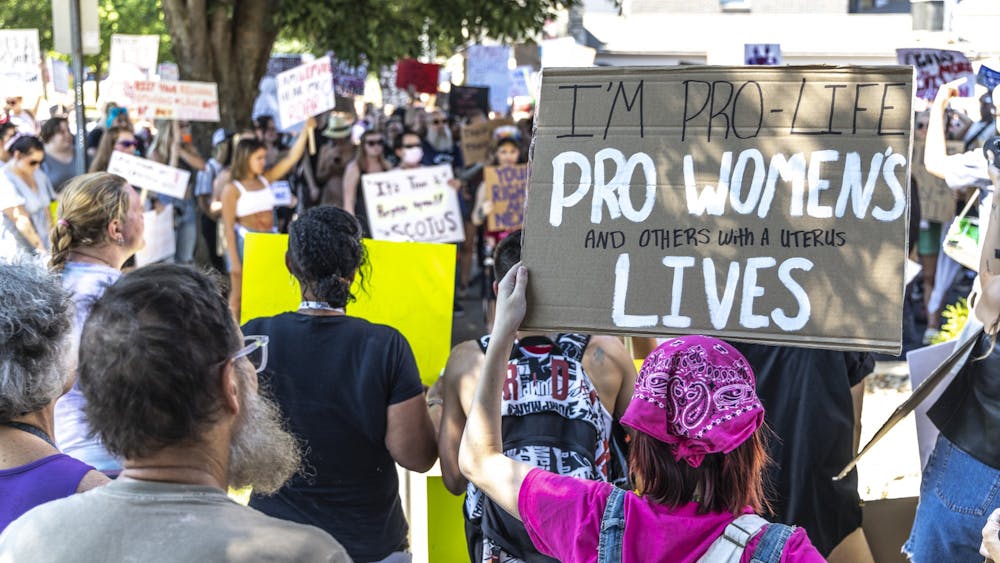 Abortion-rights protestors gather in front of the Women’s Care Center on June 27, 2022, on College Avenue during a demonstration organized by the Party for Socialism and Liberation.