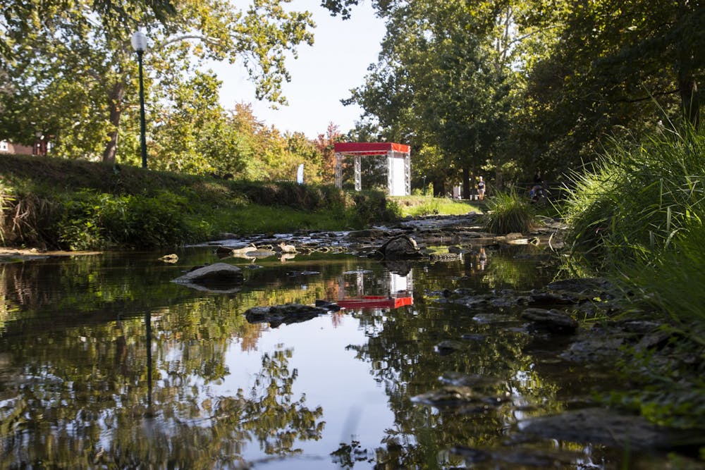 <p>Water flows between the rocks Thursday in the Jordan River. IU President Michael McRobbie will recommend that all campus landmarks named after David Starr Jordan be renamed Tuesday at the IU Board of Trustees meeting due to increased scrutiny over Jordan&#x27;s history as a eugenicist.</p>
