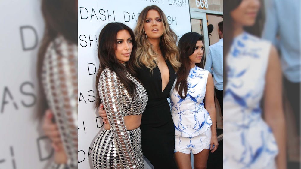 Kim Kardashian, Khloe Kardashian and Kourtney Kardashian attend the Grand Opening of DASH on March 12, 2014, at Miami Beach.