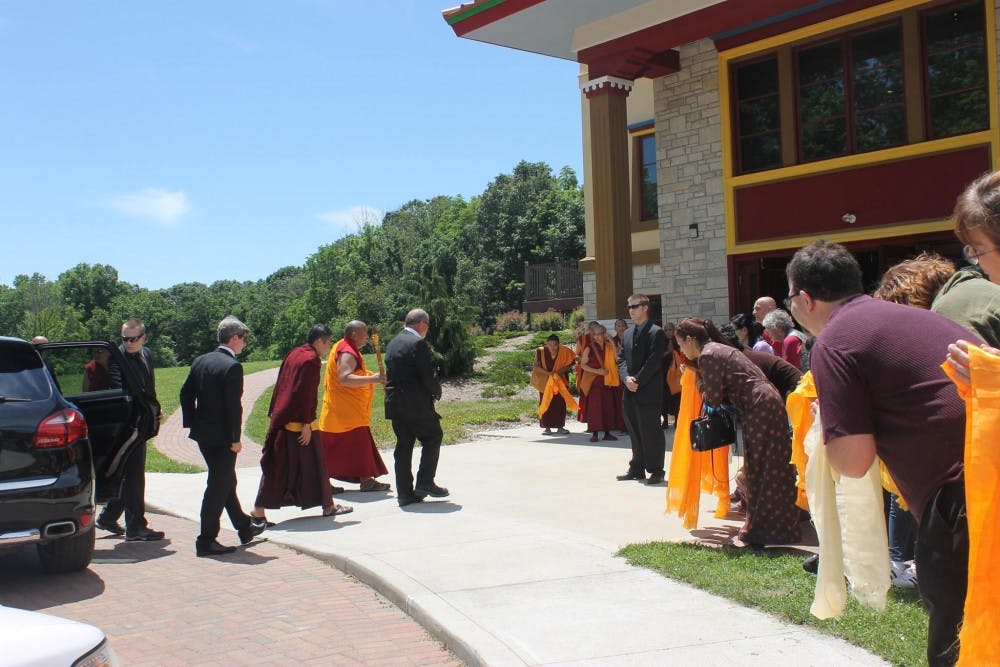 Buddhism students hold Khata to welcome the visit of Kyabje Trijang Chocktrul Rinpoche in front of Gaden Khachoe Shing Monastery.