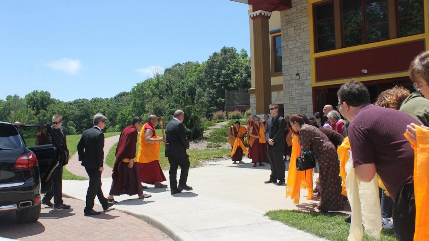 Buddhism students hold Khata to welcome the visit of Kyabje Trijang Chocktrul Rinpoche in front of Gaden Khachoe Shing Monastery.