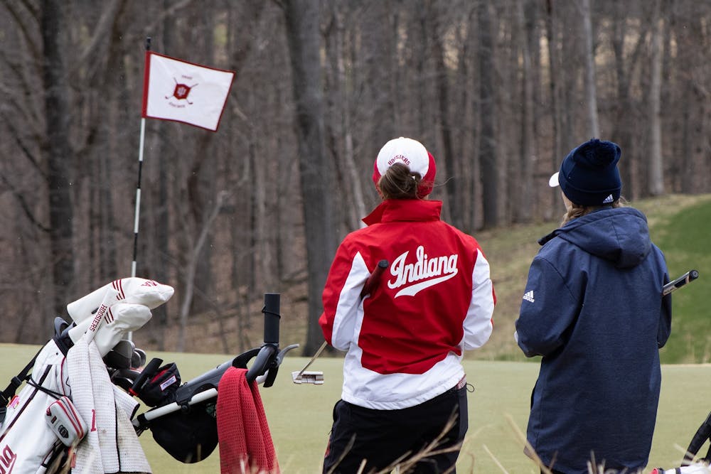 <p>Then-senior Maddie Dittoem chats with her opponent during the IU Invitational on April 9, 2022. The opening round of Indiana women’s golf’s competition in the Evie Odom Invitational was suspended Thursday at the Princess Anne Country Club in Virginia Beach, Virginia, due to gusting winds, according to IU Athletics.  </p>