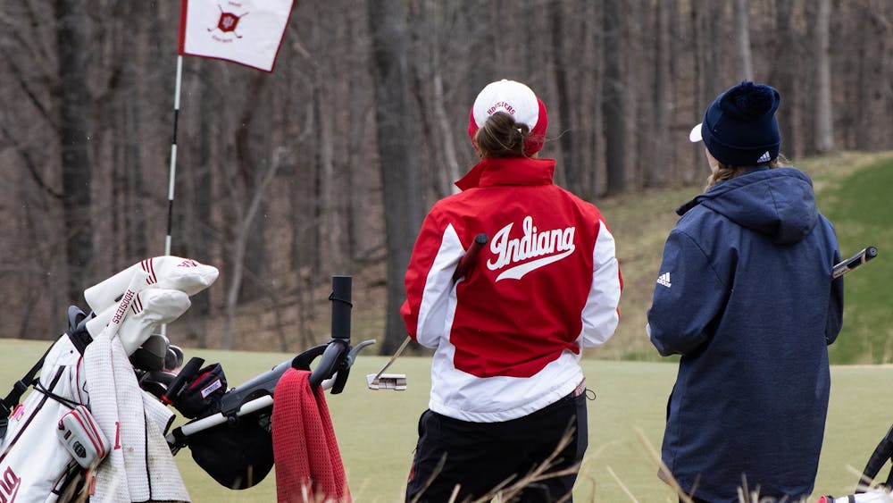 Then-senior Maddie Dittoem chats with her opponent during the IU Invitational on April 9, 2022. The opening round of Indiana women’s golf’s competition in the Evie Odom Invitational was suspended Thursday at the Princess Anne Country Club in Virginia Beach, Virginia, due to gusting winds, according to IU Athletics.  
