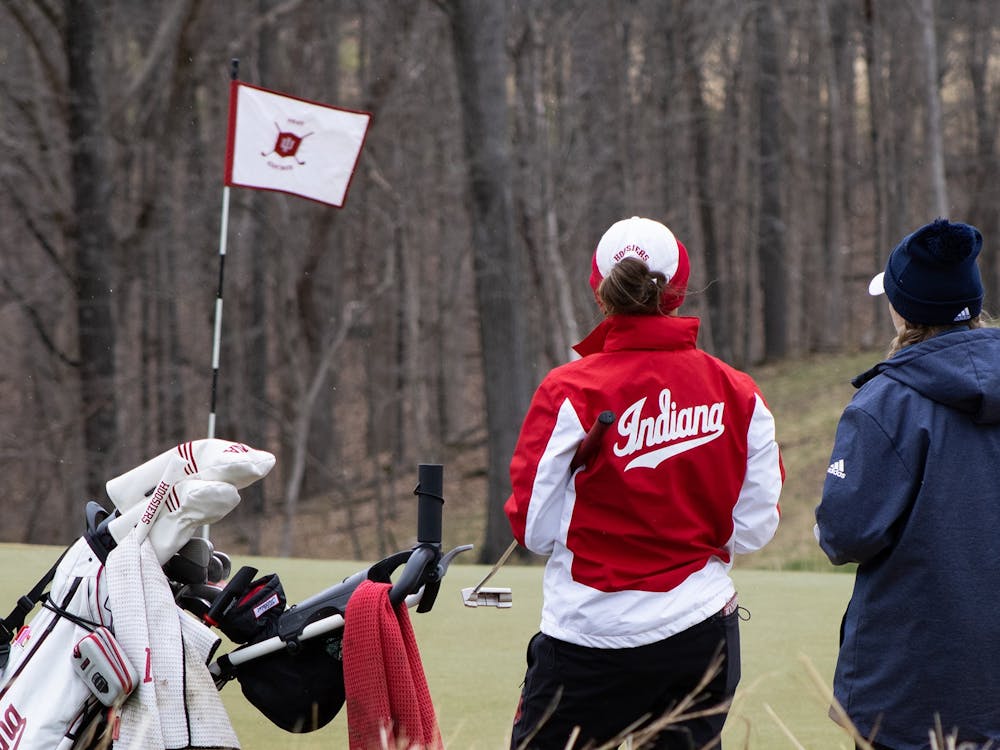 Then-senior Maddie Dittoem chats with her opponent during the IU Invitational on April 9, 2022. The opening round of Indiana women’s golf’s competition in the Evie Odom Invitational was suspended Thursday at the Princess Anne Country Club in Virginia Beach, Virginia, due to gusting winds, according to IU Athletics.  