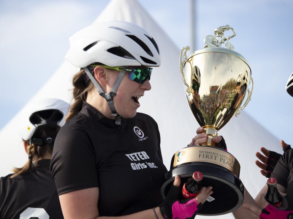 A member of Teter Cycling gasps at her team’s first place trophy April 12 at Bill Armstrong Stadium. The team beat Delta Gamma and SKI in the final laps.