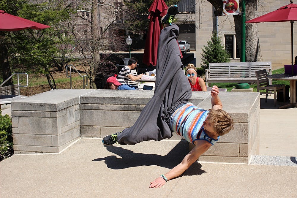 Jonathon Garlinghouse practices falling on Saturday at the IU Parkour and Freerunning Collegiate Jam 2015. "You have to know how to fall," said Garlinghouse. 