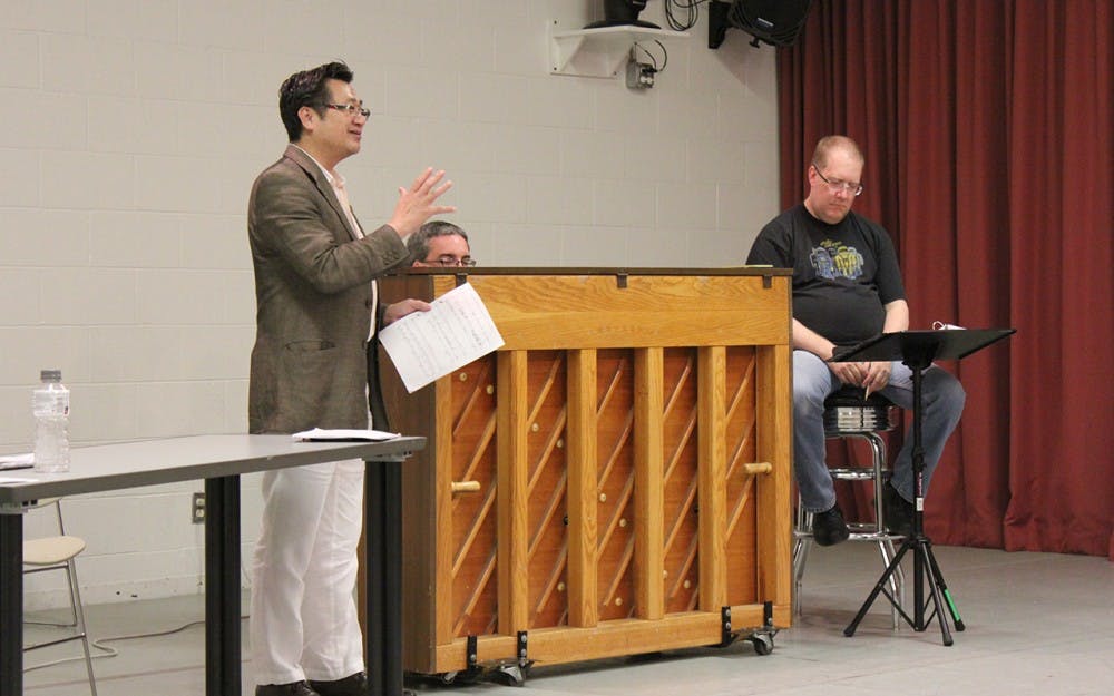 Jacobs School of Music professor P. Q. Phan directs performers for an upcoming show. Phan organized the Jacobs faculty trip to Vietnam. 
