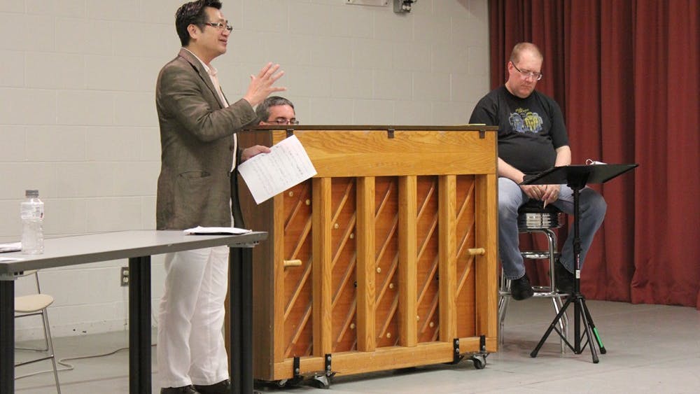Jacobs School of Music professor P. Q. Phan directs performers for an upcoming show. Phan organized the Jacobs faculty trip to Vietnam. 