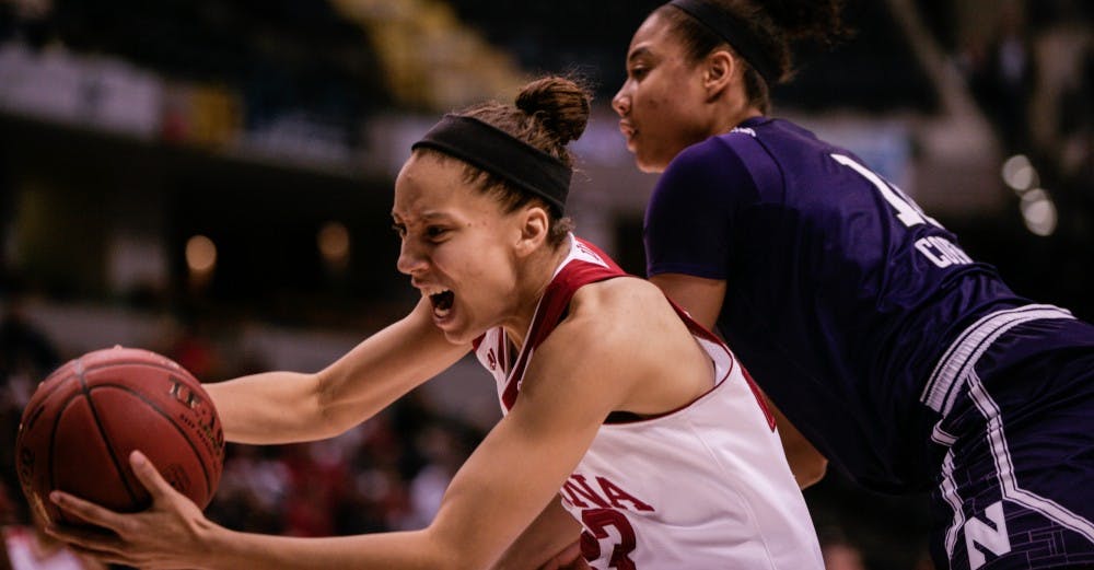 Junior guard Alexis Gassion grabs the ball before it goes out of bounds. The Hoosiers lost 73-79 to Northwestern on Friday at Bankers Life Fieldhouse in Indianapolis.