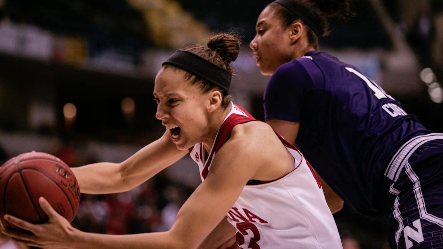 Junior guard Alexis Gassion grabs the ball before it goes out of bounds. The Hoosiers lost 73-79 to Northwestern on Friday at Bankers Life Fieldhouse in Indianapolis.