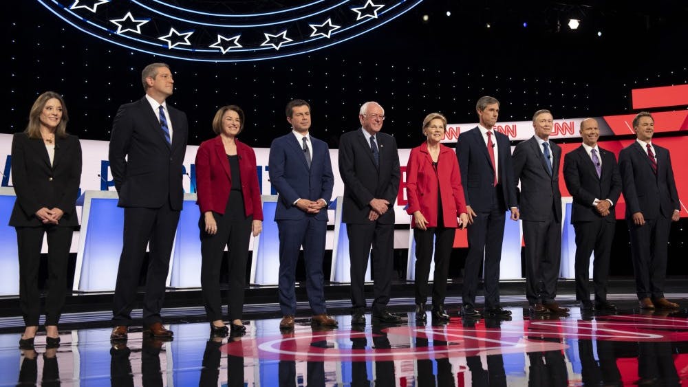 Democratic primary candidates stand before the start of the second Democratic primary debate July 30 at the Fox Theatre in Detroit. The next debate will take place Thursday in Houston.